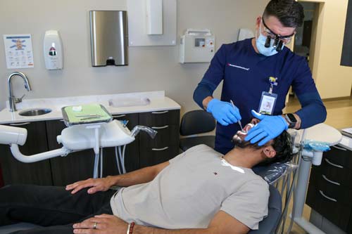 A dentist with a patient at the Culinary Health Center